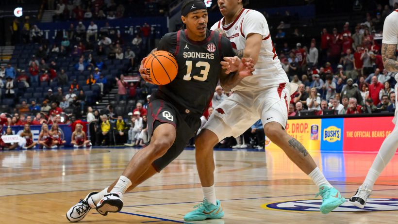 Sooners forward Tae Tavis drives to the hoop versus Arkansas.