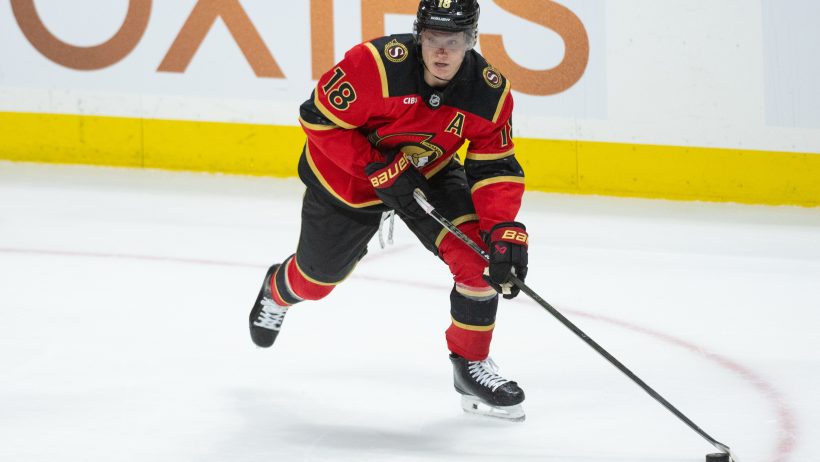 Tim Stutzle carries the puck inside the Penguins zone.