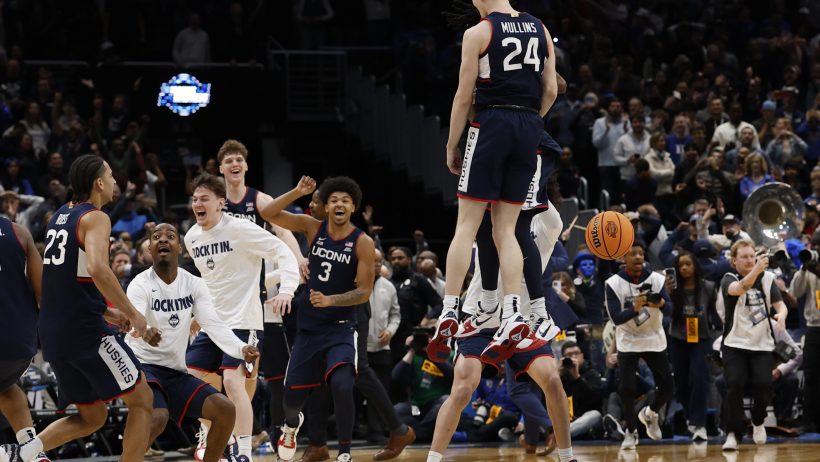 UConn Huskies guard Braylon Mullins congratulated by teammates