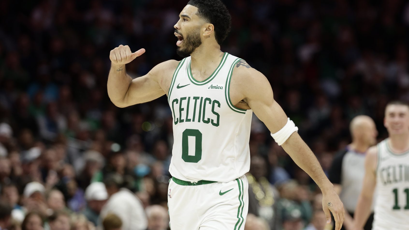 Jayson Tatum celebrates after a bucket versus the Hornets.