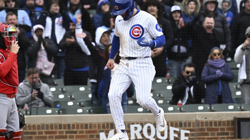 Nico Hoerner crosses the plate for the Cubs in a game versus the Angels.