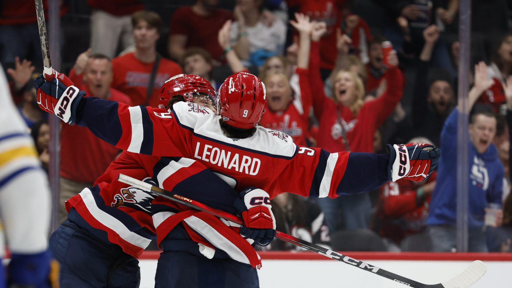 The Capitals Dylan Strome and Ryan Leonard celebrate a Washington goal vs the Sabres.