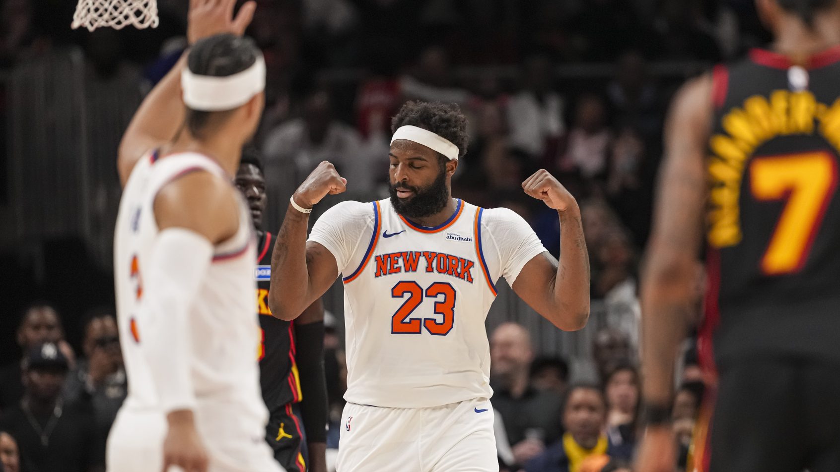 New York Knicks center Mitchell Robinson flexing