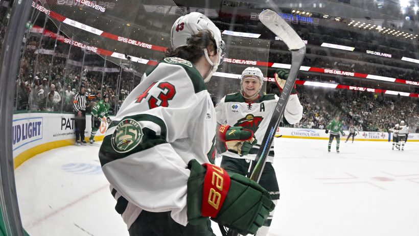 Quinn Hughes and Kirill Kaprizov celebrate a goal versus the Stars.
