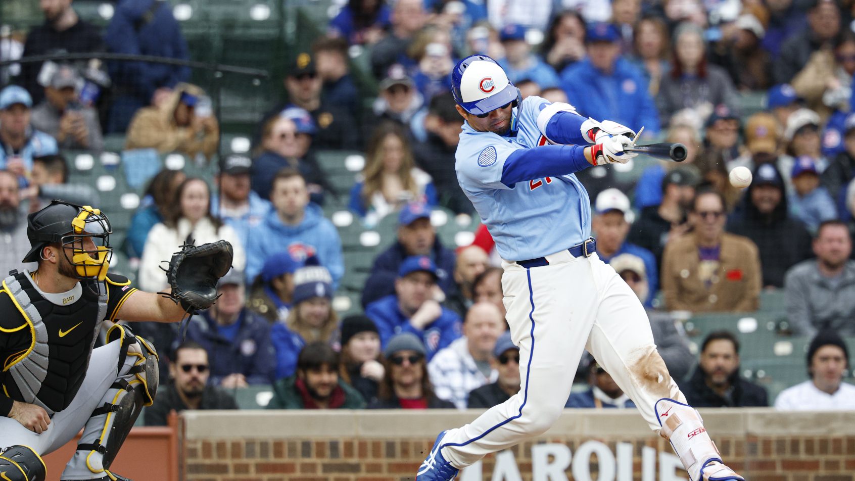 Seiya Suzuki singles in a game versus the Pirates at Wrigley Field.