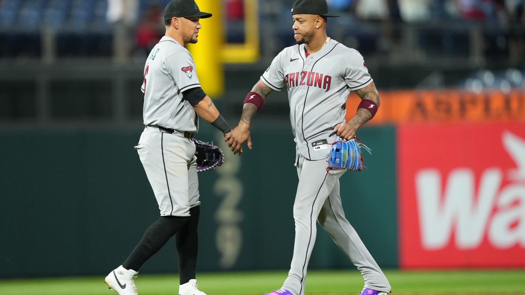 The Diamondbacks celebrate their victory over the Phillies in Game 1 of their series.