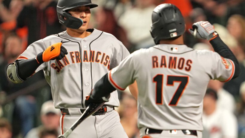 Jung Hoo Lee and Heliot Ramos celebrate a two-run home run versus the Orioles.
