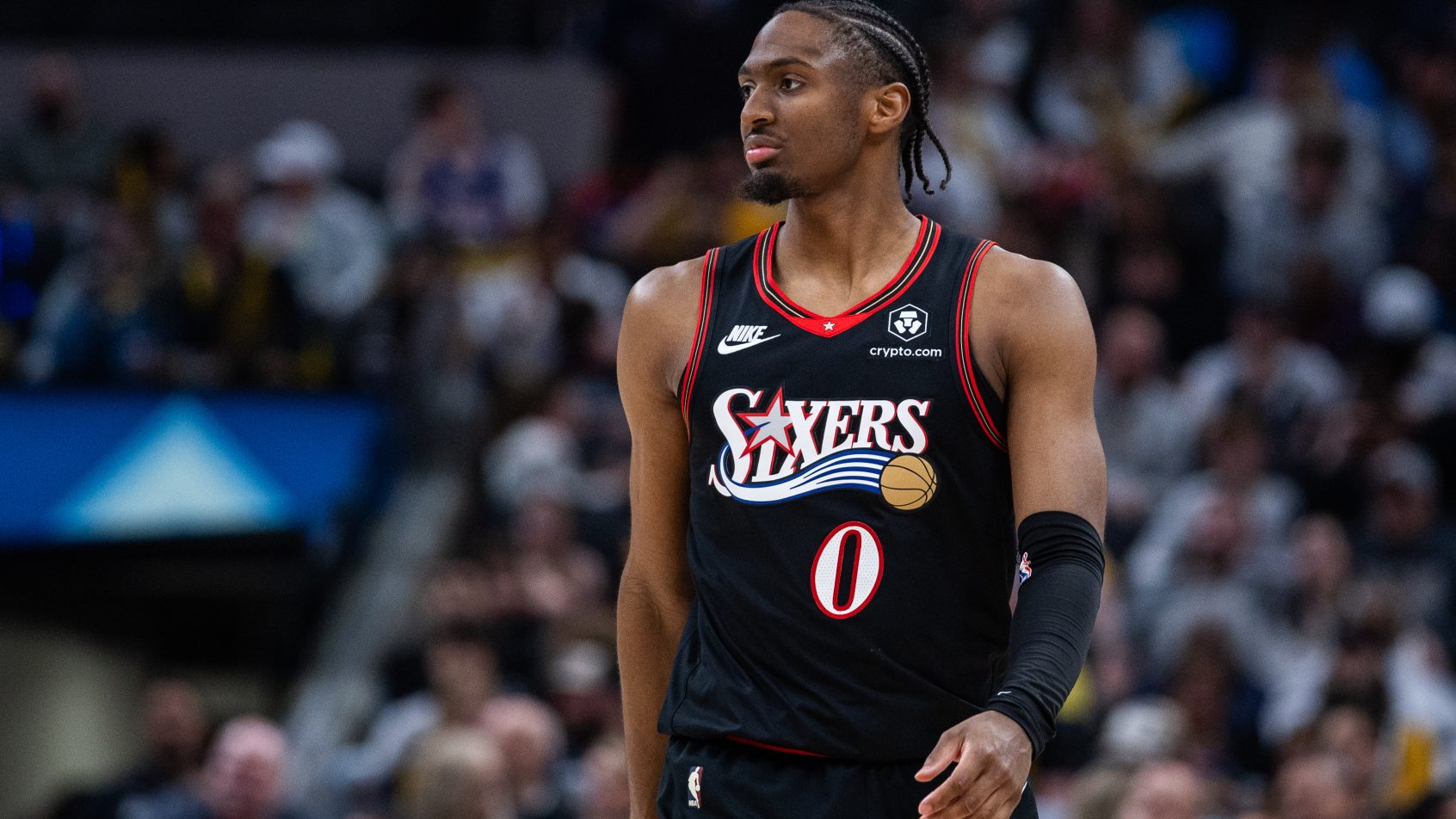 Tyrese Maxey walks up the court during a timeout versus the Pacers.