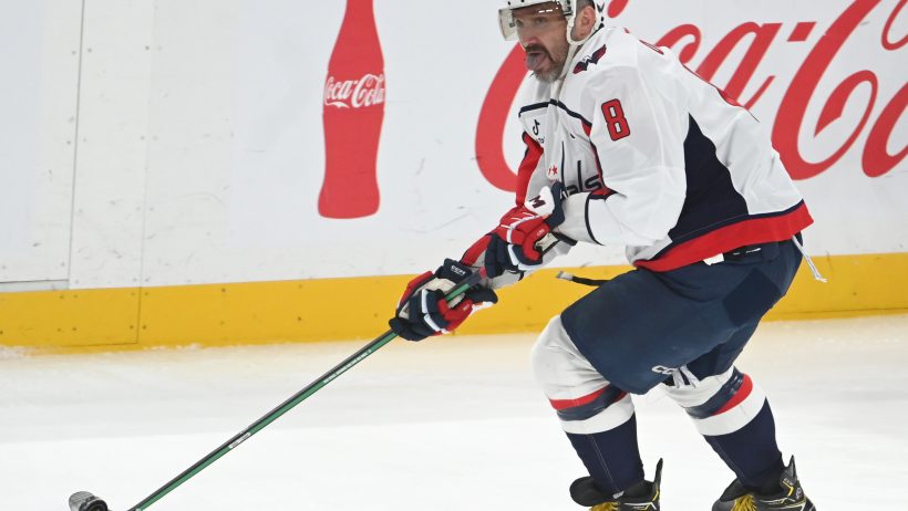 Alex Ovechkin carries the puck up ice versus the Penguins.