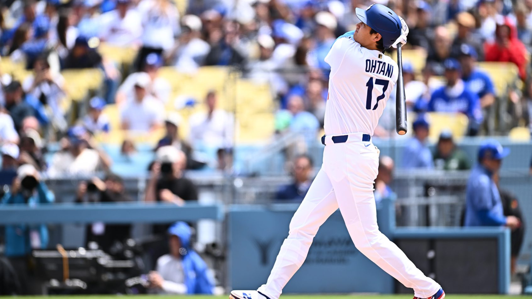 Los Angeles Dodgers two-way player Shohei Ohtani hits a solo homerun during the first inning against the Texas Rangers.