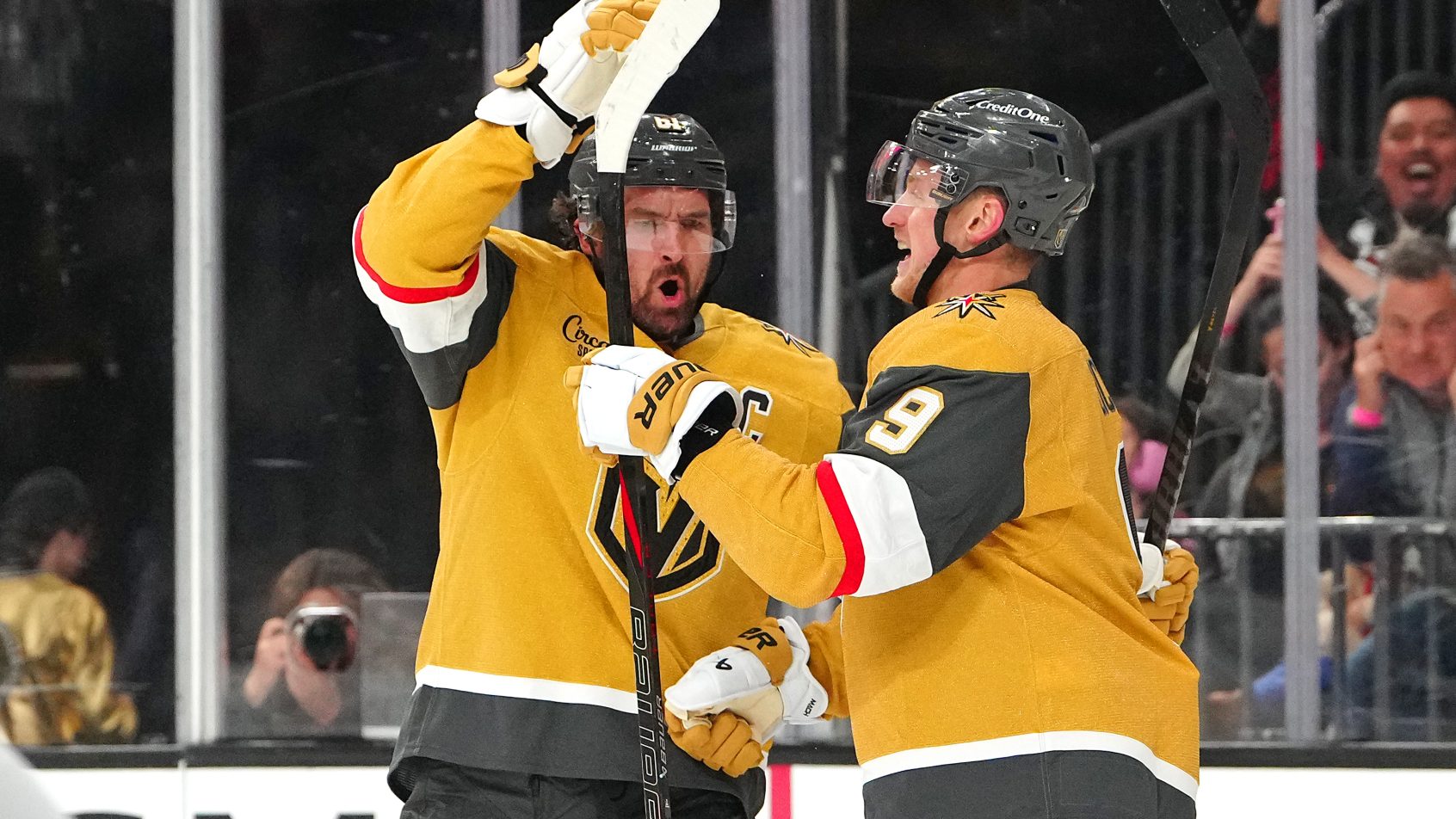 Mark Stone celebrates with Jack Eichel