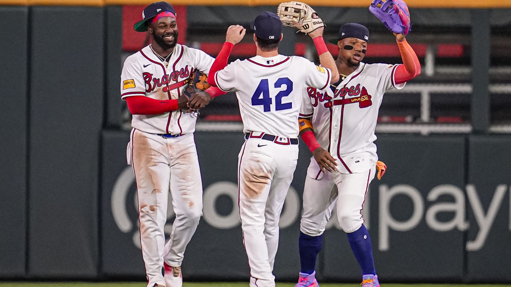 Michael Harris II Mike Yastrzemski and Ronald Acuna Jr celebrating