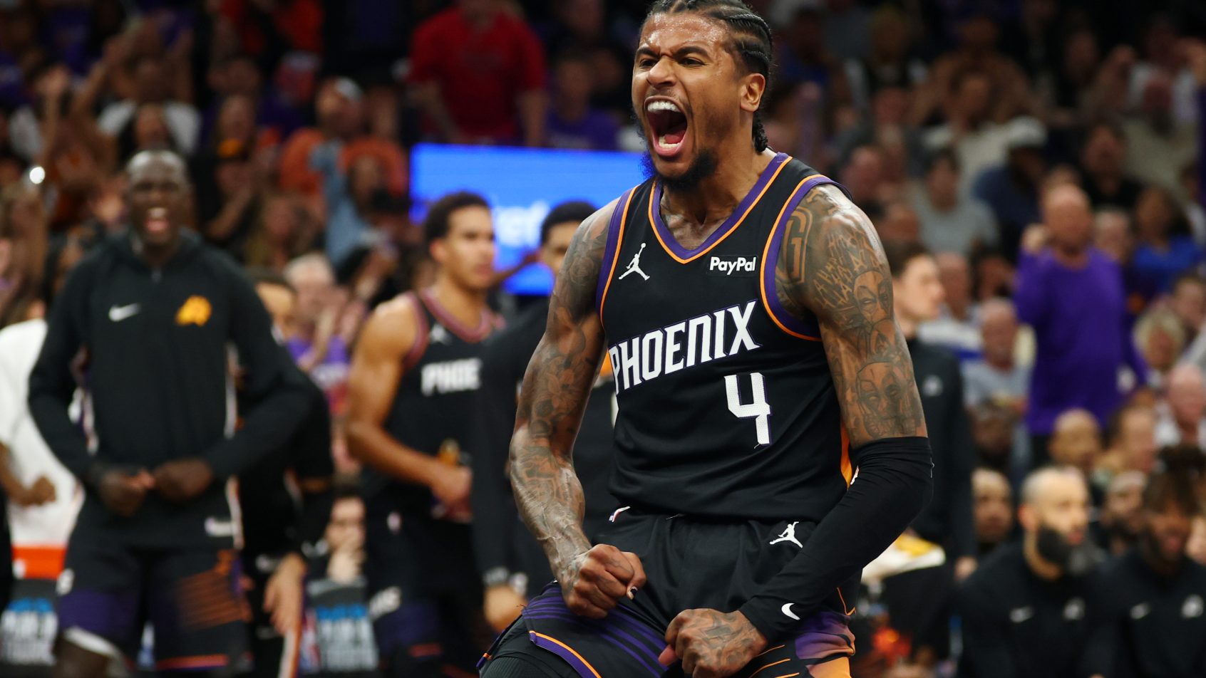 Jalen Green celebrates after a dunk versus the Warriors.