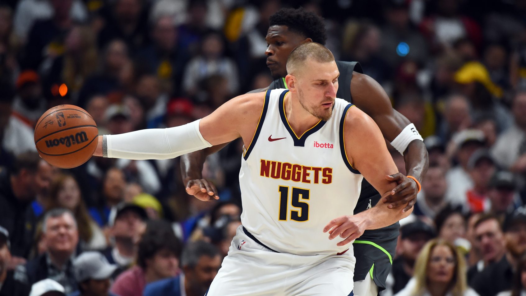 Nikola Jokic backs down Anthony Edwards in Game 1 of the T-wolves vs Nuggets series