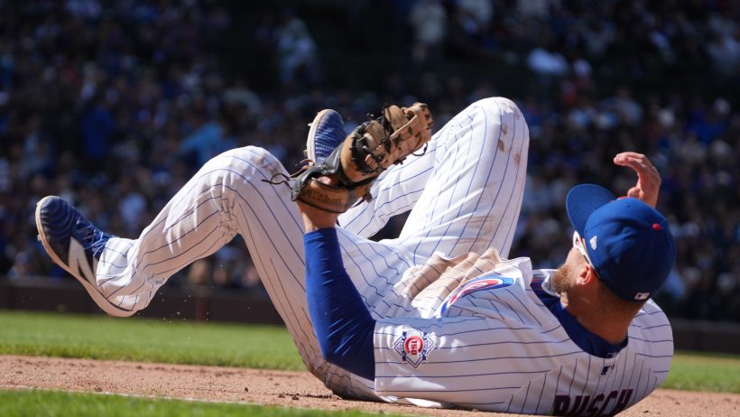 Chicago Cubs first baseman Michael Busch on his back
