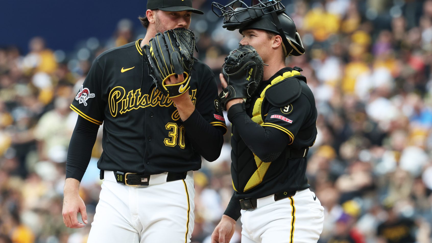 Paul Skenes talks to his catcher.
