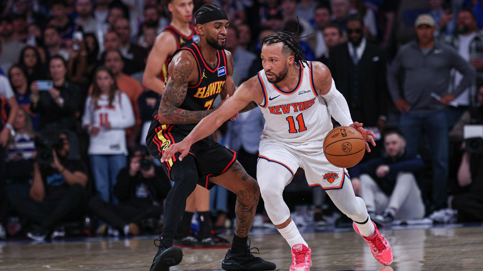 Jalen Brunson dribbles the all against Nickeil Alexander-Walker