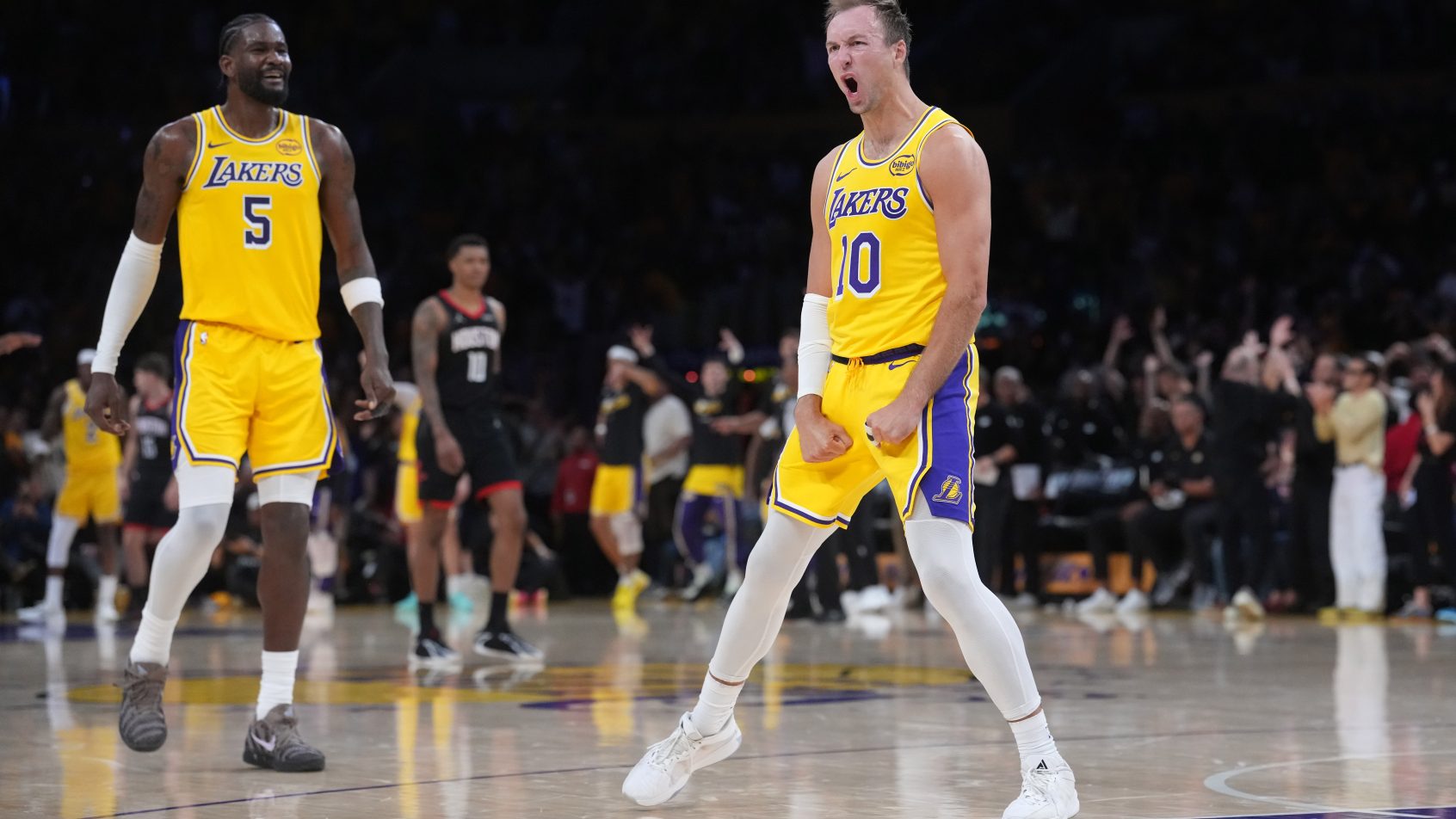 Luke Kennard celebrates after knocking down a three versus the Rockets.