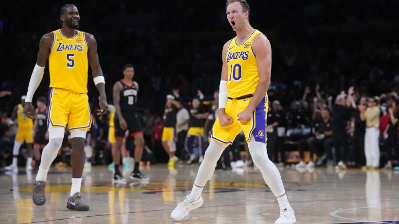 Luke Kennard celebrates after knocking down a three versus the Rockets.