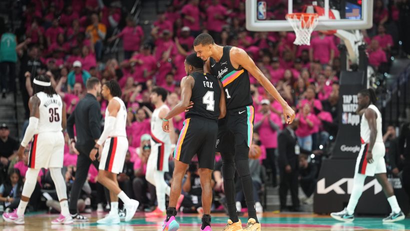 Victor Wembanyama hugs De'Aaron Fox