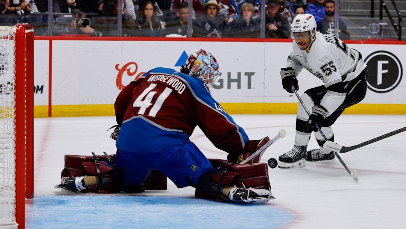 Scott Wedgewood stops Quinton Byfield in tight.