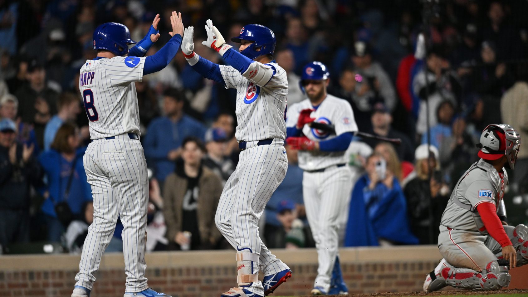 Seiya Suzuki celebrates with Ian Happ