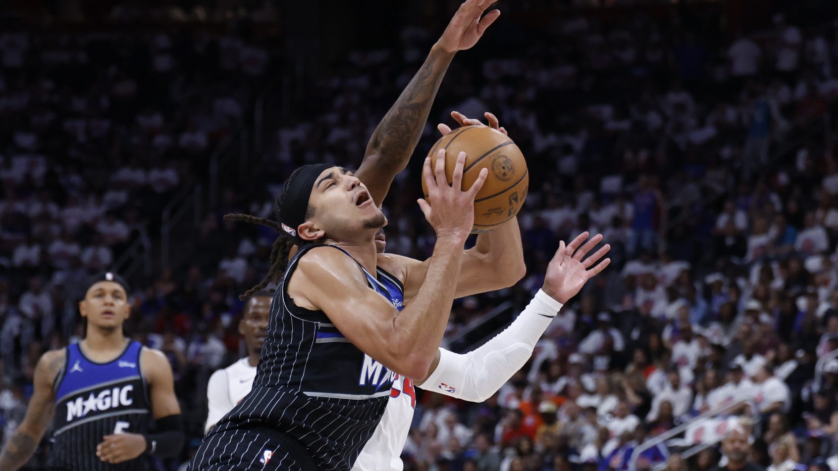 Paolo Banchero is fouled going to the basket against the Pistons.