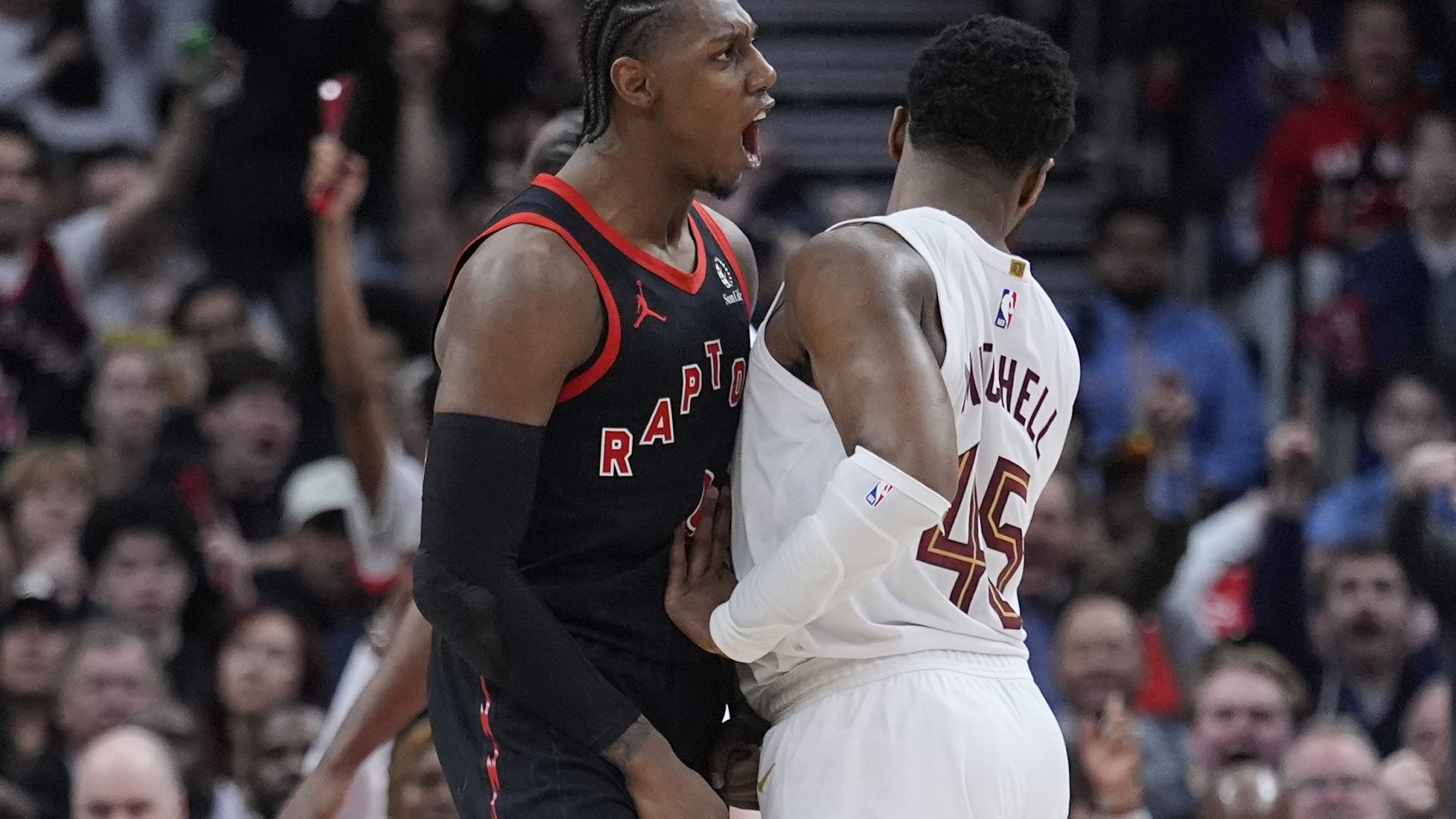 RJ Barrett screams in front of Donovan Mitchell
