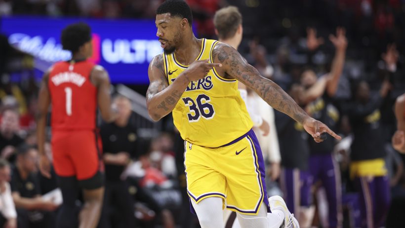 Marcus Smart celebrates after splashing a triple versus the Rockets.