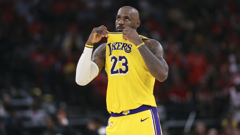 LeBron James wiping face with jersey