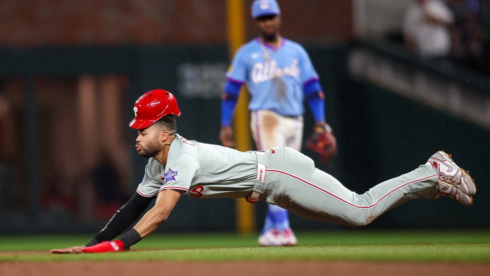 Philadelphia Phillies center fielder Justin Crawford slides into second base