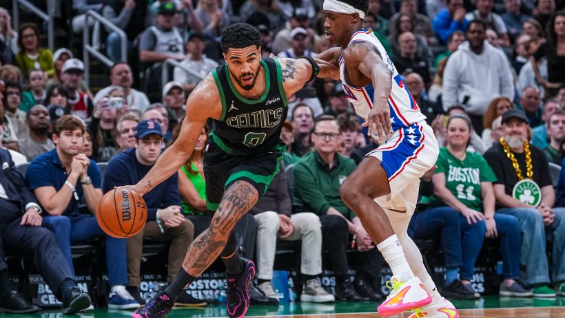 Jayson Tatum takes the the ball to the hoop.
