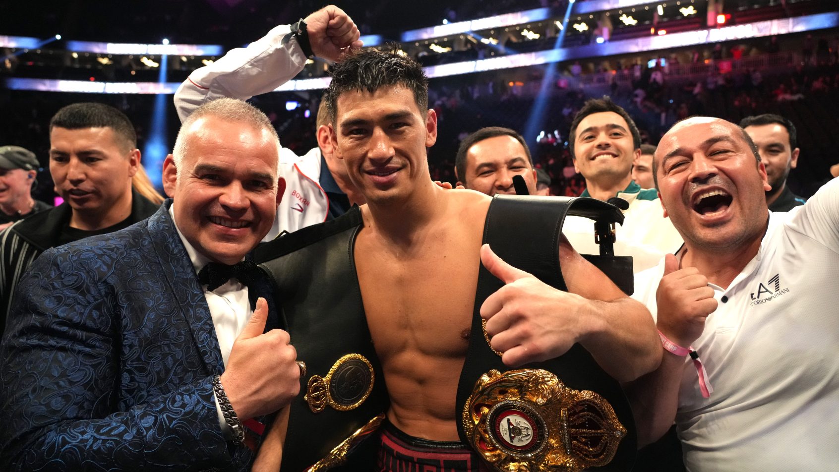 May 7, 2022; Las Vegas, Nevada, USA; Dimitry Bivol (black trunks) celebrates with his team after defeating Canelo Alvarez (not pictured) during their light heavyweight championship bout at T-Mobile Arena. Mandatory Credit: Joe Camporeale-Imagn Images