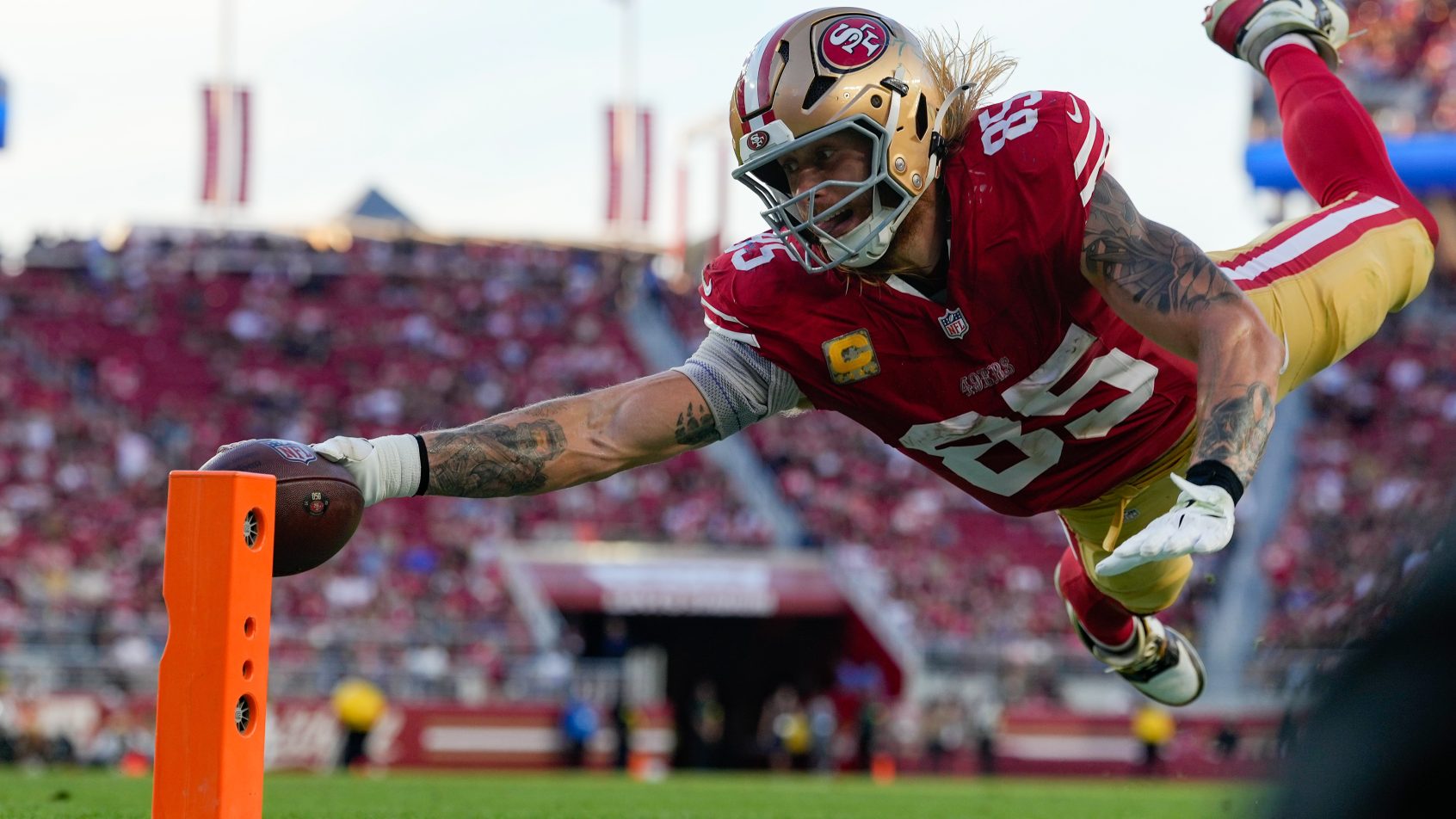 San Francisco 49ers tight end George Kittle stretches for the goal line
