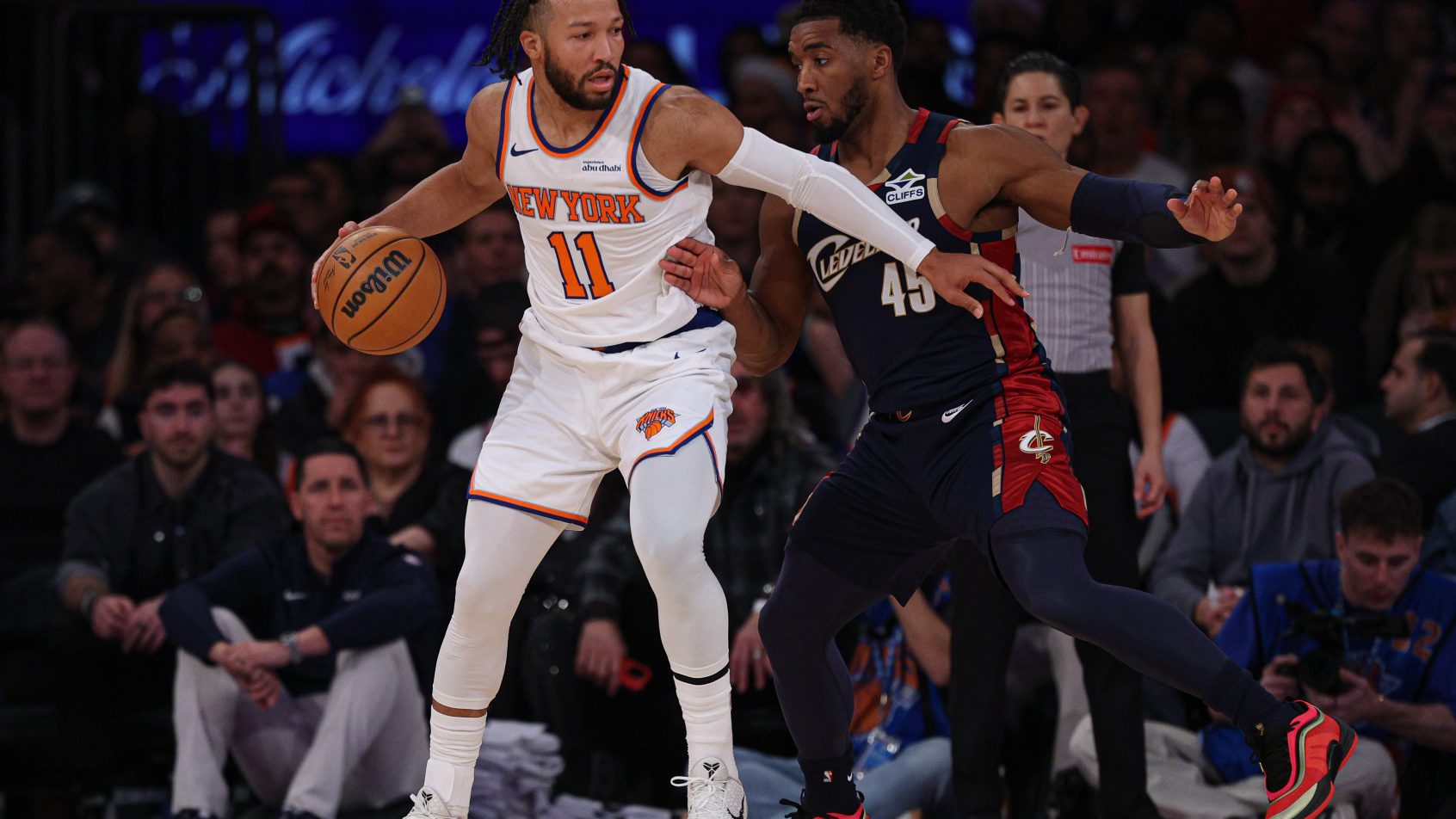 New York Knicks guard Jalen Brunson is guarded by Cleveland Cavaliers guard Donovan Mitchell