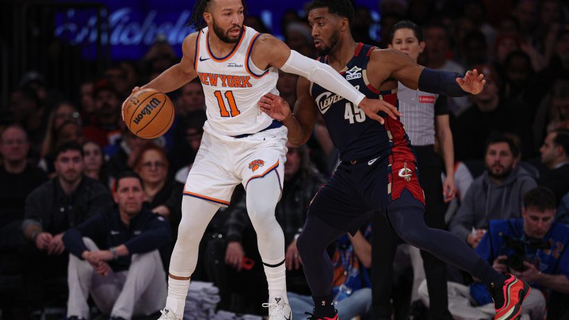 New York Knicks guard Jalen Brunson is guarded by Cleveland Cavaliers guard Donovan Mitchell