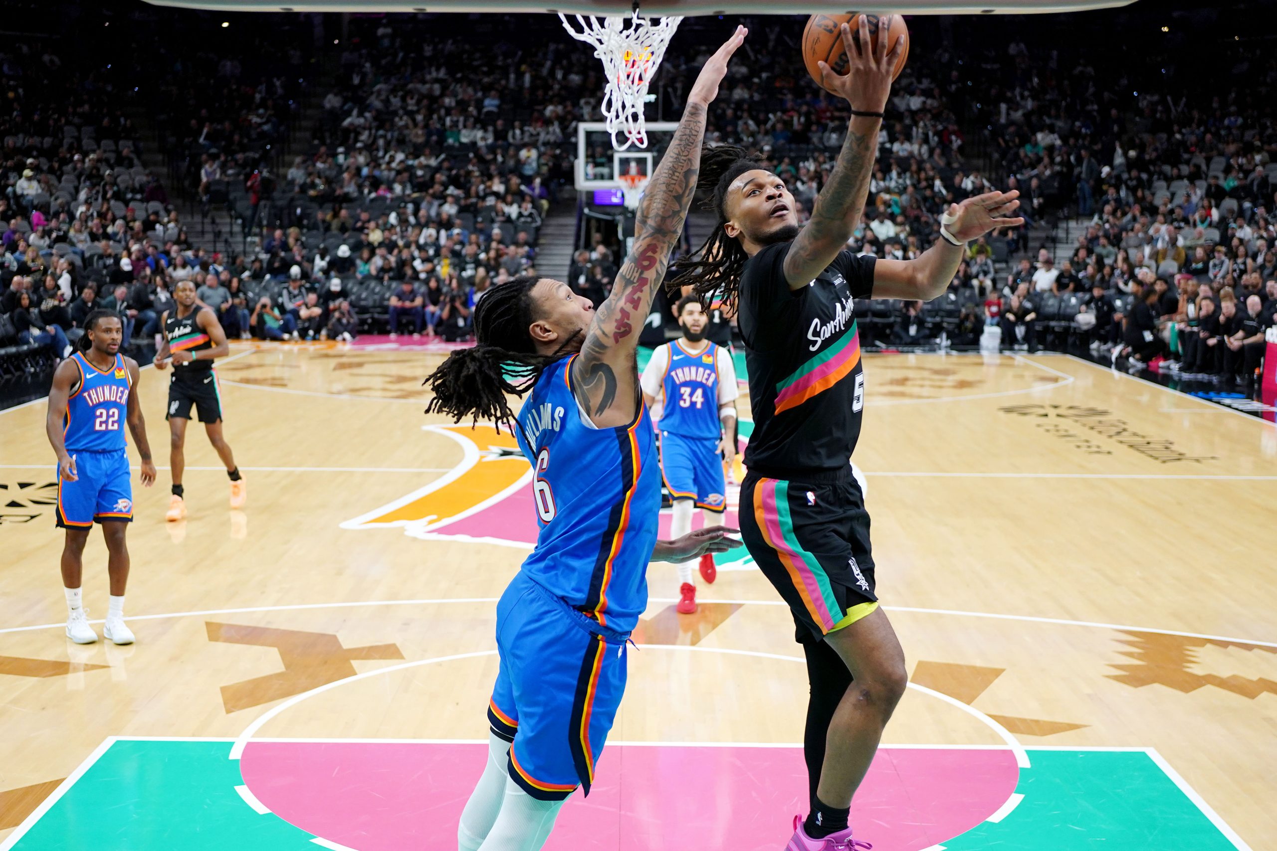 San Antonio Spurs guard Stephon Castle drives against Oklahoma City Thunder forward Jaylin Williams