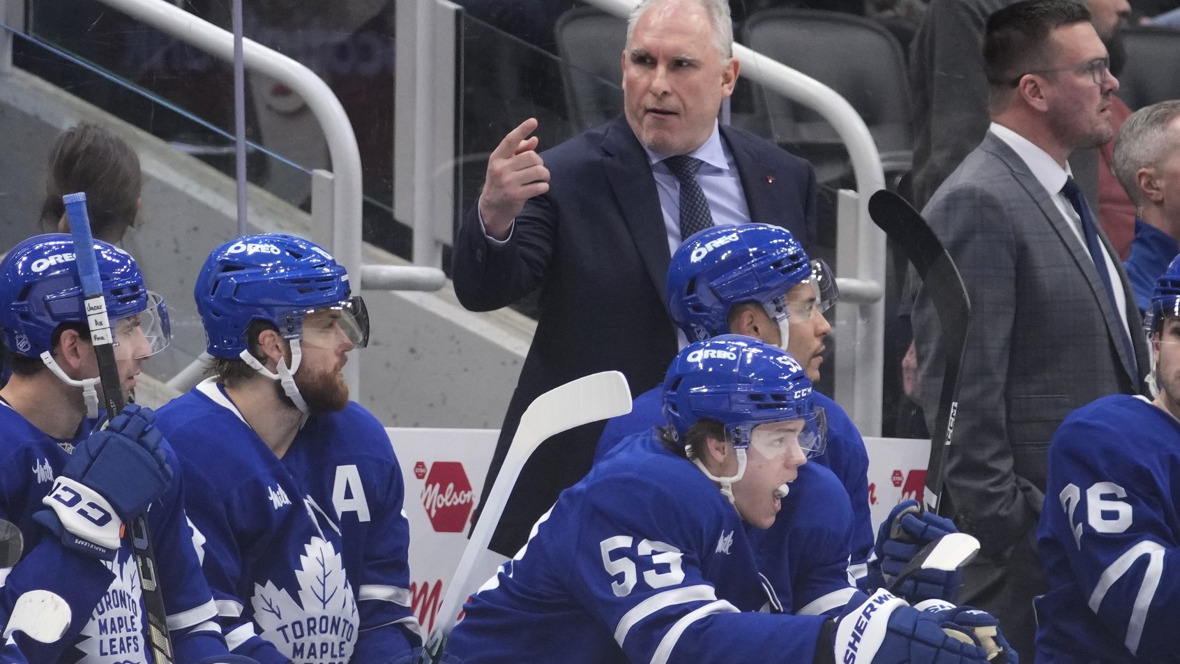 Toronto Maple Leafs head coach Craig Berube directs a player onto the ice