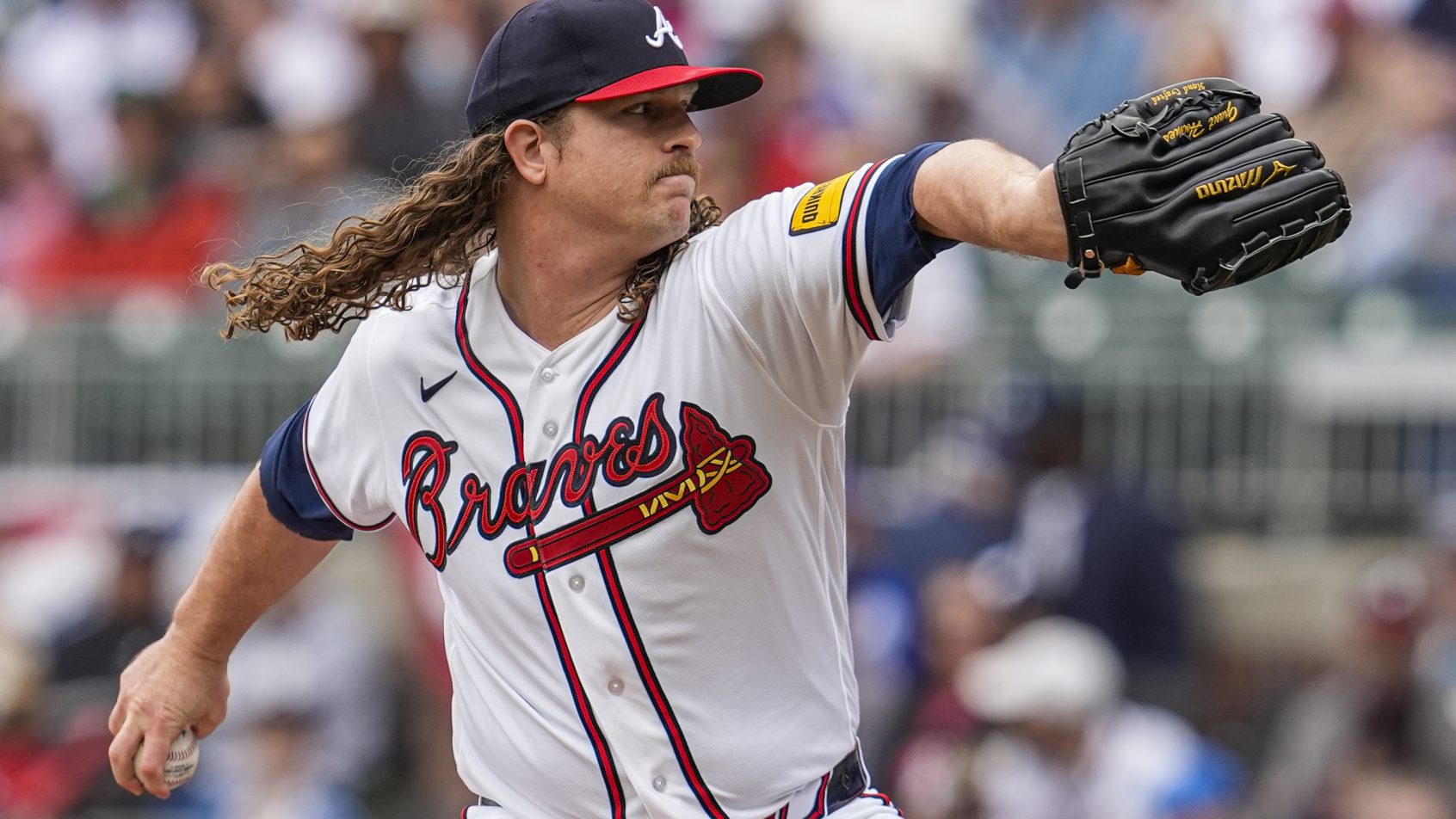 Grant Holmes throws pitch