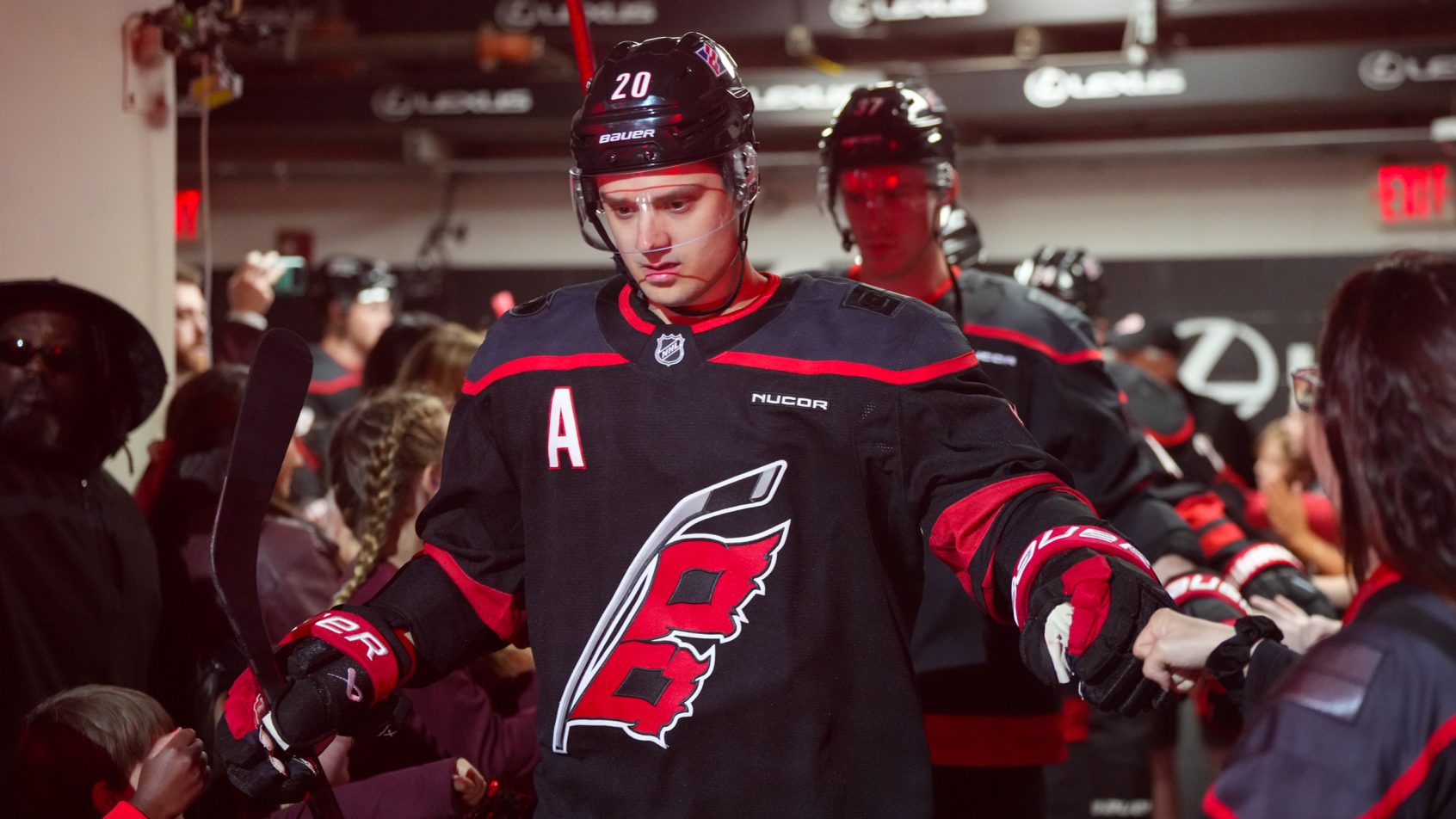 Sebastian Aho gets ready to hop onto the ice.