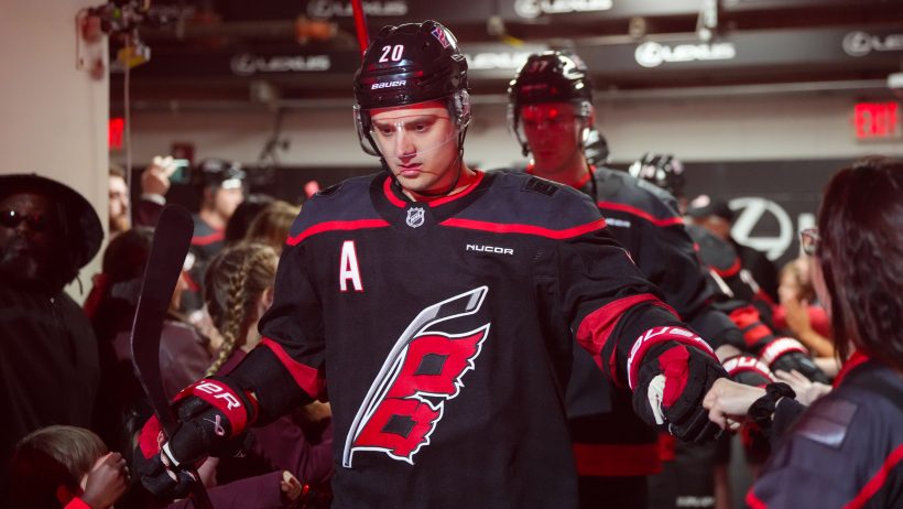 Sebastian Aho gets ready to hop onto the ice.