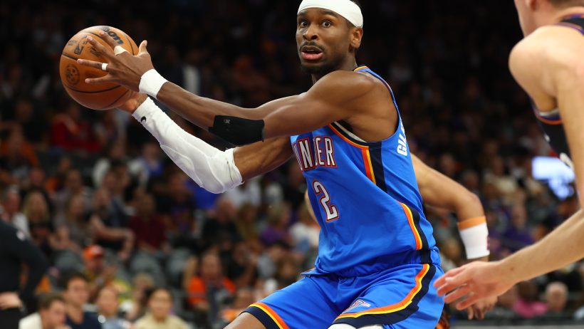 Shai Gilgeous-Alexander attacks against the Suns in an NBA playoff game.
