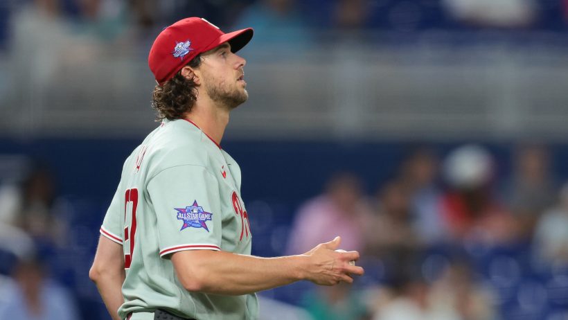Aaron Nola holing baseball with bare hand