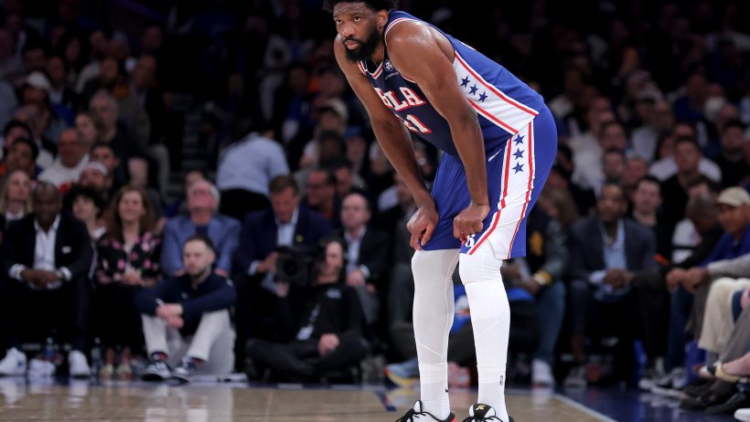 Philadelphia 76ers center Joel Embiid stands with his hands on his knees