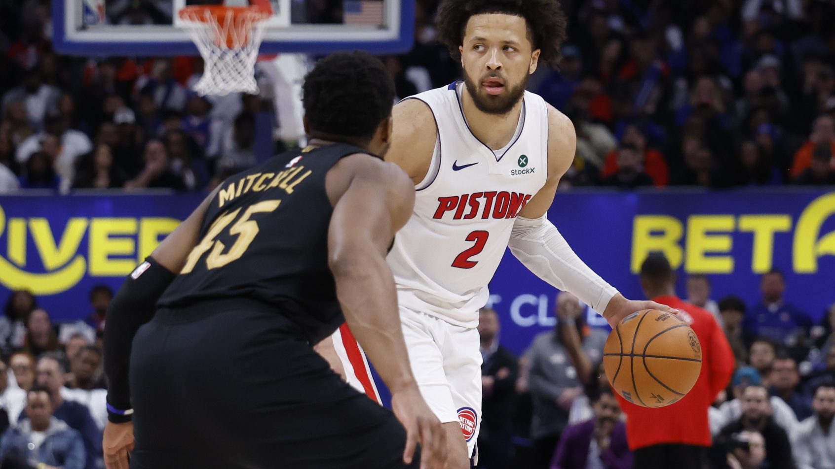 Cade Cunningham is guarded by Donovan Mitchell in Game 1 of their 2nd Round series.