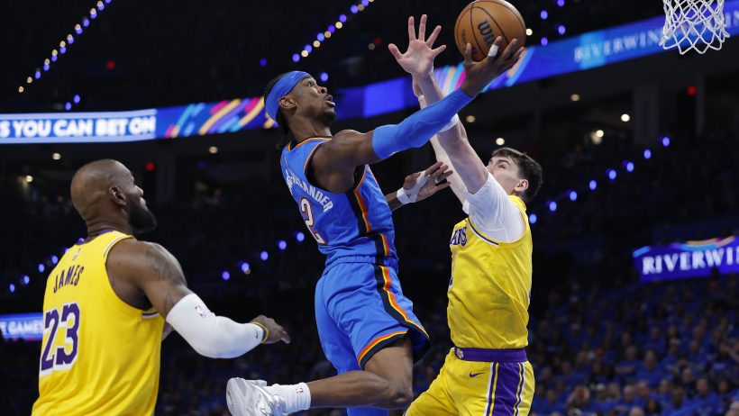 Shai Gilgeous-Alexander tries to score on LeBron James and the Lakers