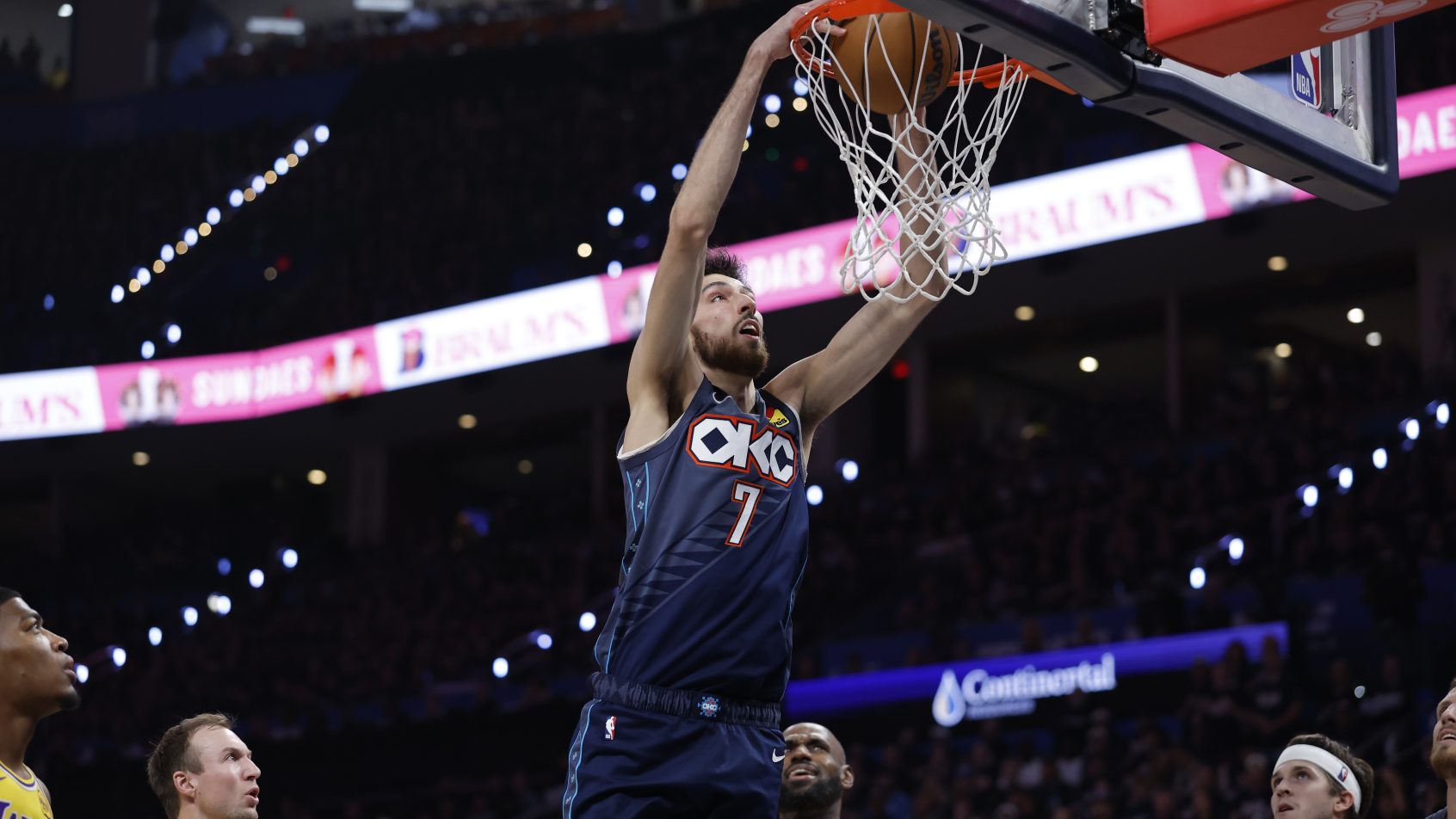 Chet Holmgren rises up for the dunk in a playoff game versus the Lakers.