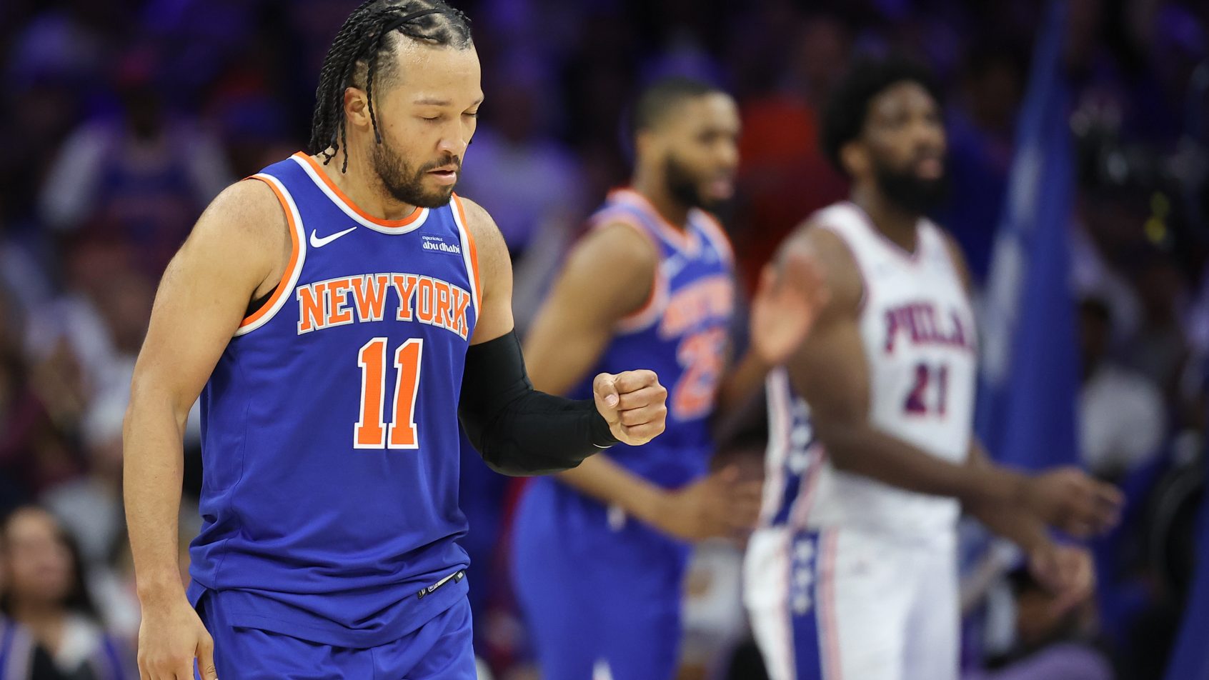 Jalen Brunson celebrates in a playoff game versus the 76ers.