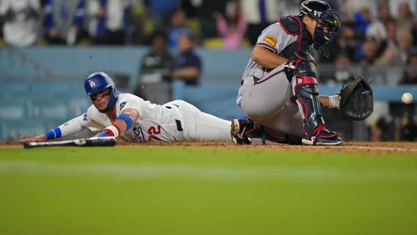 Miguel Rojas slides in safe