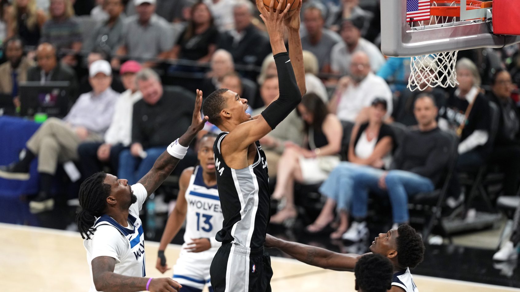 Victor Wembanyama goes to the basket in a playoff game versus the Timberwolves.